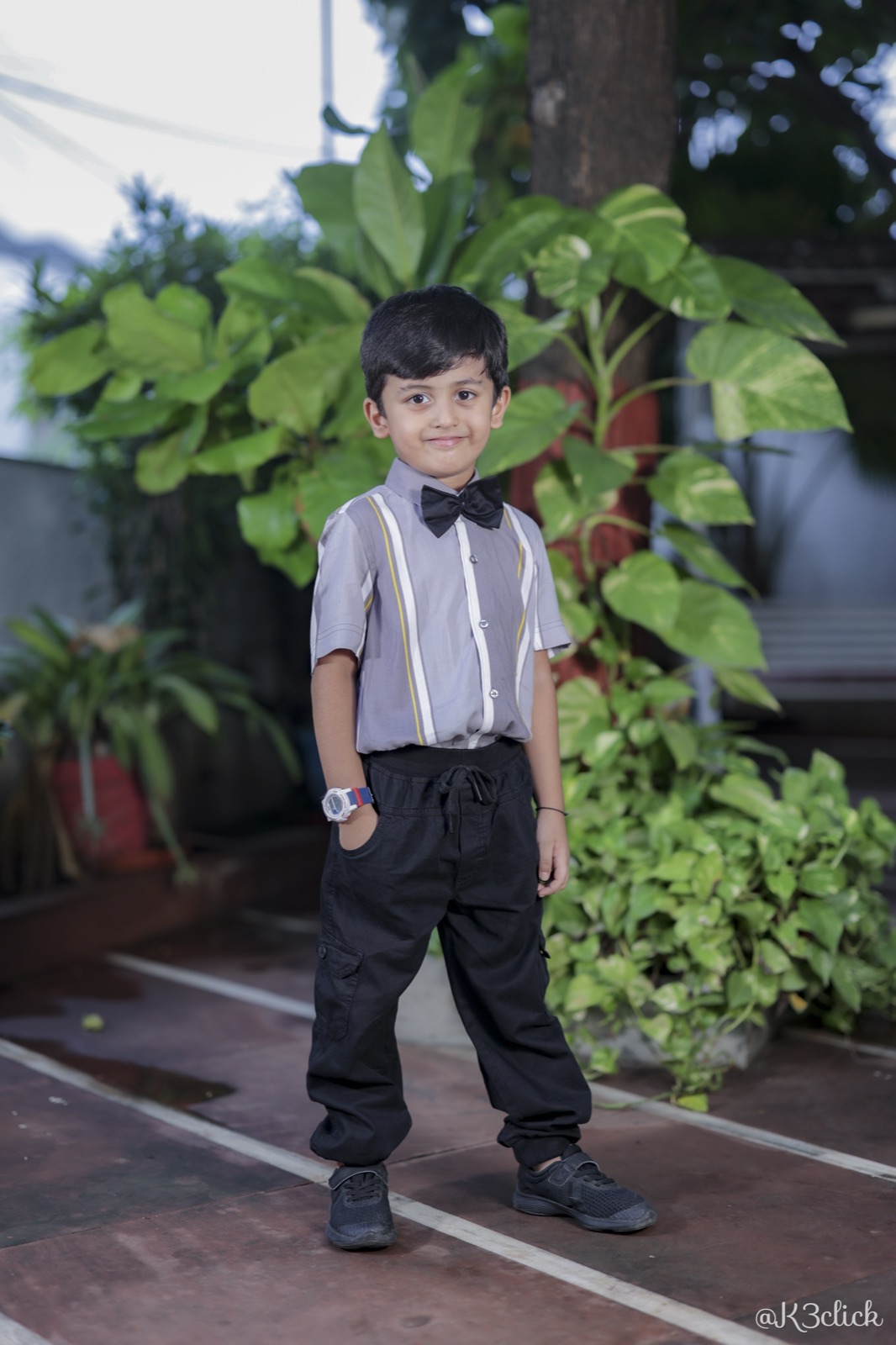 Grey striped shirt with bow tie